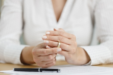 woman removing wedding ring